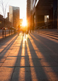 People in city during sunset