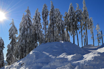 Low angle view of snowcapped mountain against sky