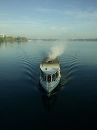 High angle view of boat in lake against sky