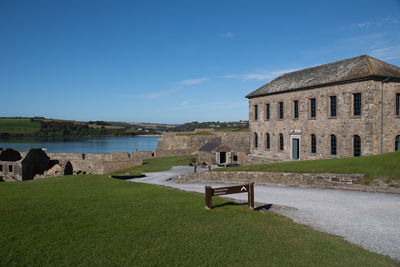 Historic building by sea against sky