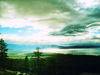 Scenic view of landscape against cloudy sky