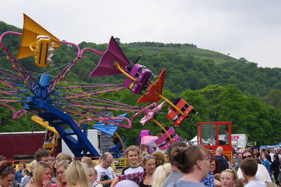People enjoying at amusement park
