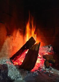 Bonfire on log at night