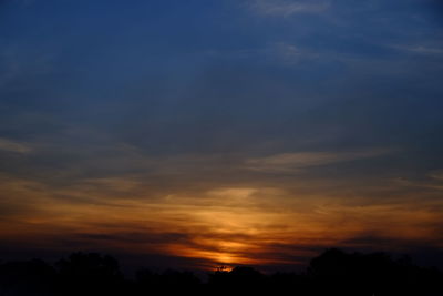 Low angle view of dramatic sky during sunset