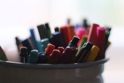 Close-up of multi colored pencils on table