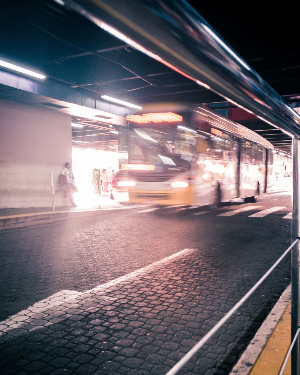 illuminated, transportation, mode of transportation, motion, night, blurred motion, public transportation, rail transportation, architecture, city, long exposure, land vehicle, street, railroad track, speed, track, incidental people, built structure, outdoors, railroad station platform