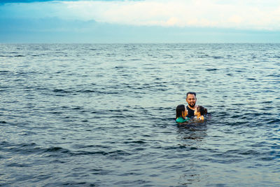 Bearded man swimming in the sea.