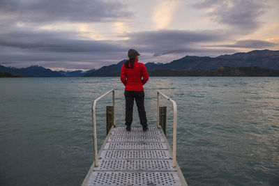 Woman standing on pier at lago rio tranquillo, carretera austral