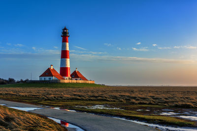 Westerheversand lighthouse on the north sea a landmark of the eiderstedt peninsula in germany.