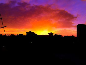 Silhouette of city at sunset