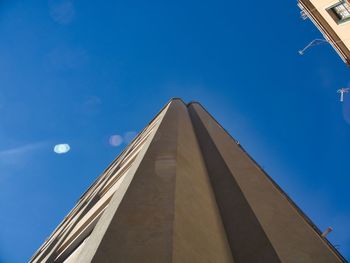 Low angle view of building against blue sky