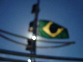 Low angle view of flag against sky