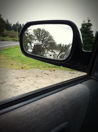 Cropped image of car on road