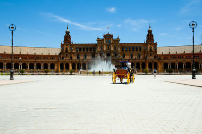 People in front of historical building