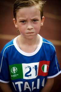 Portrait of cute boy in soccer jersey