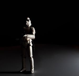 Portrait of young man over black background