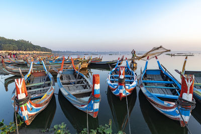 Boats moored at harbor