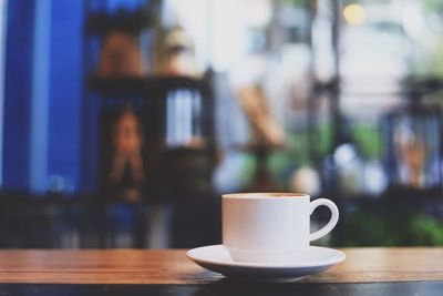 Close-up of coffee served on table in cafe