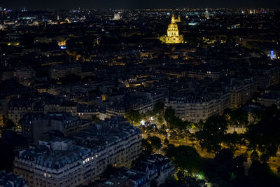 Aerial view of city lit up at night