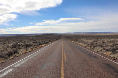 Empty road against sky