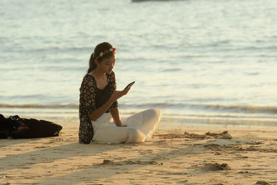 Woman sitting on beach