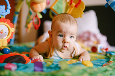 Cute baby girl playing at home