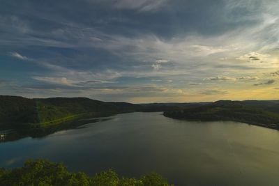 Scenic view of lake against sky during sunset