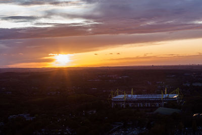 High angle view of buildings against sky during sunset