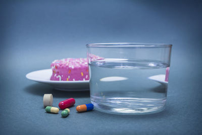 Close-up of multi colored glass on table