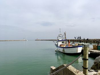 Fishing boat moored at pier