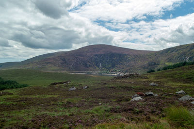 Scenic view of landscape and mountains against sky