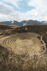 View of old amphitheater against mountains