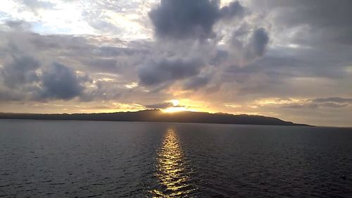 Scenic view of storm clouds over water