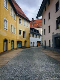 Narrow street along buildings