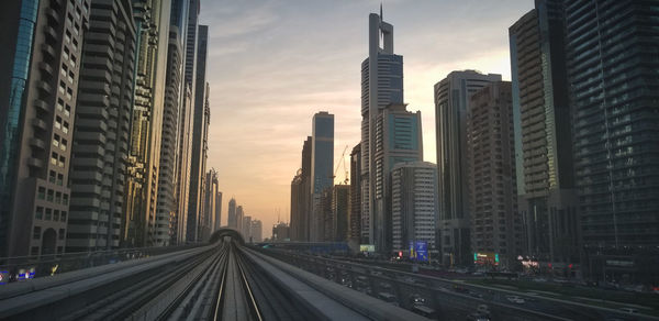 View of city buildings at sunset in dubai