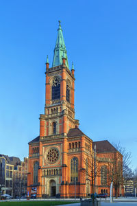 Low angle view of cathedral against clear blue sky