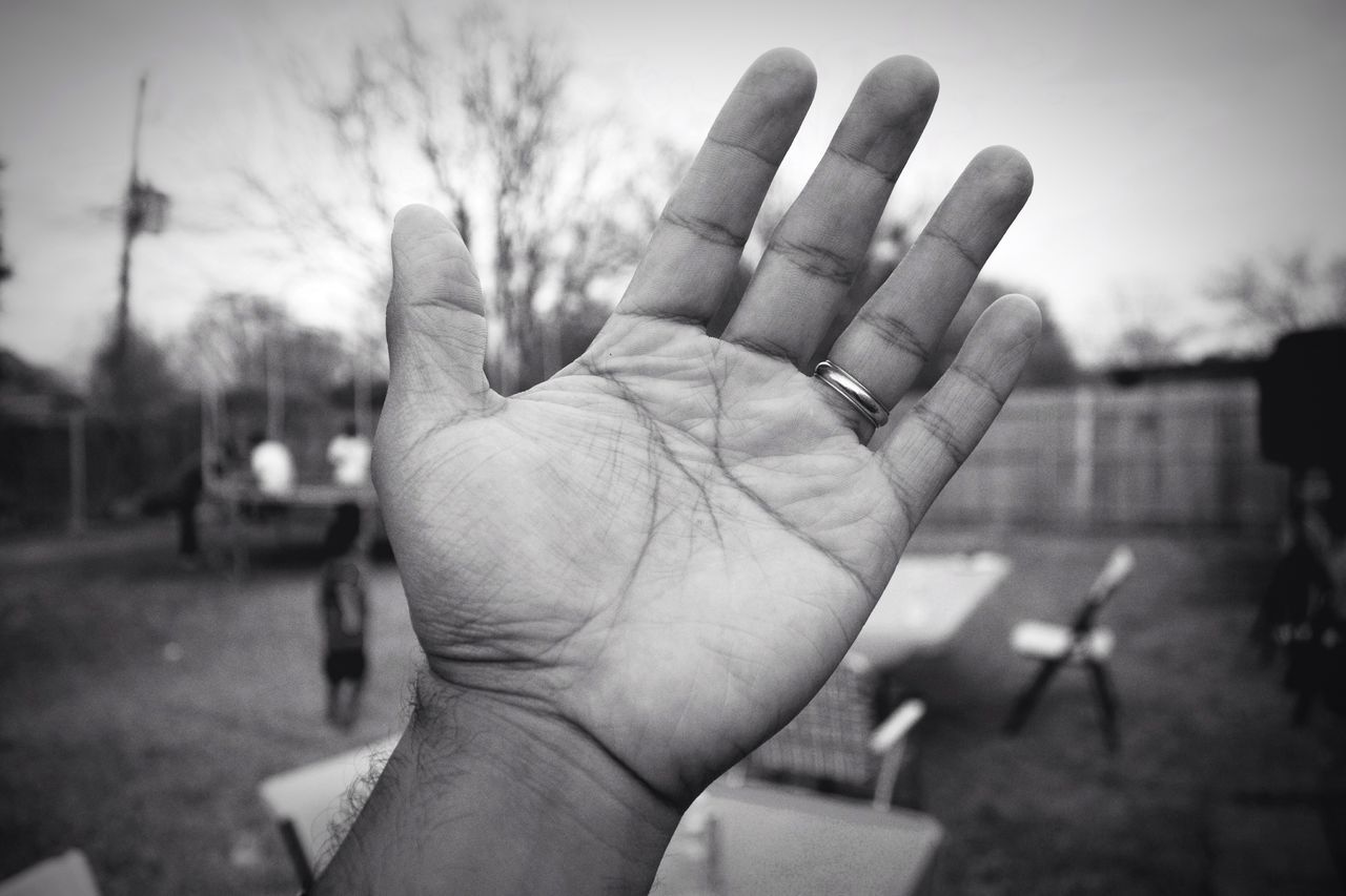 person, human finger, part of, cropped, holding, focus on foreground, personal perspective, unrecognizable person, close-up, lifestyles, sky, men, leisure activity, silhouette, selective focus, day, outdoors