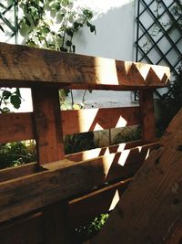 Low angle view of wooden window on table against building