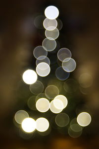 Defocused image of illuminated christmas tree