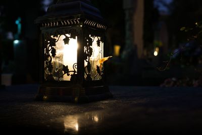 Candle in the night on cemetery during all saints. slovakia