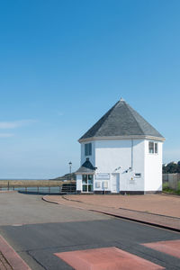 Built structures against clear blue sky