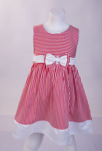 Striped red dress on mannequin against white background