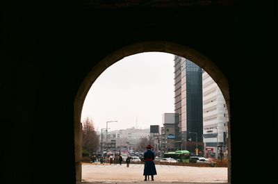 Rear view of woman walking in city