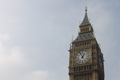 Low angle view of big ben tower against sky