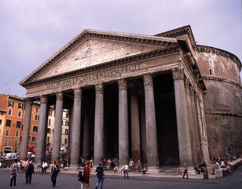 Group of people in front of historical building