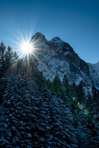 Scenic view of snowcapped mountains against clear sky