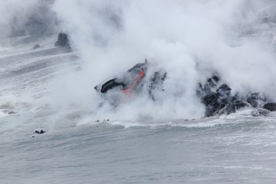 Lava smoke over sea