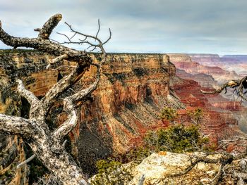 Rock formations on landscape against sky