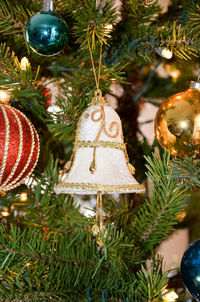 Close-up of christmas decorations hanging on tree