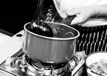 Close-up of man preparing food in kitchen